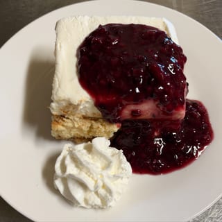 Slice of Polish Cheesecake with Fruit Topping