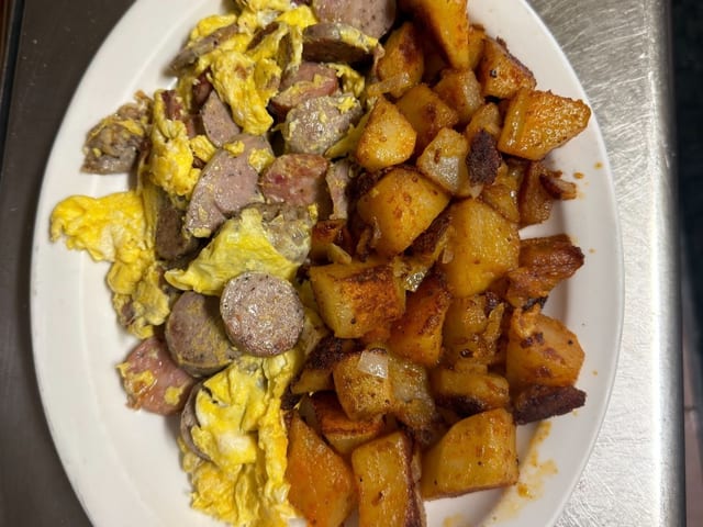 11. Eggs Scrambled together w/Kielbasa Home fries and Toast.